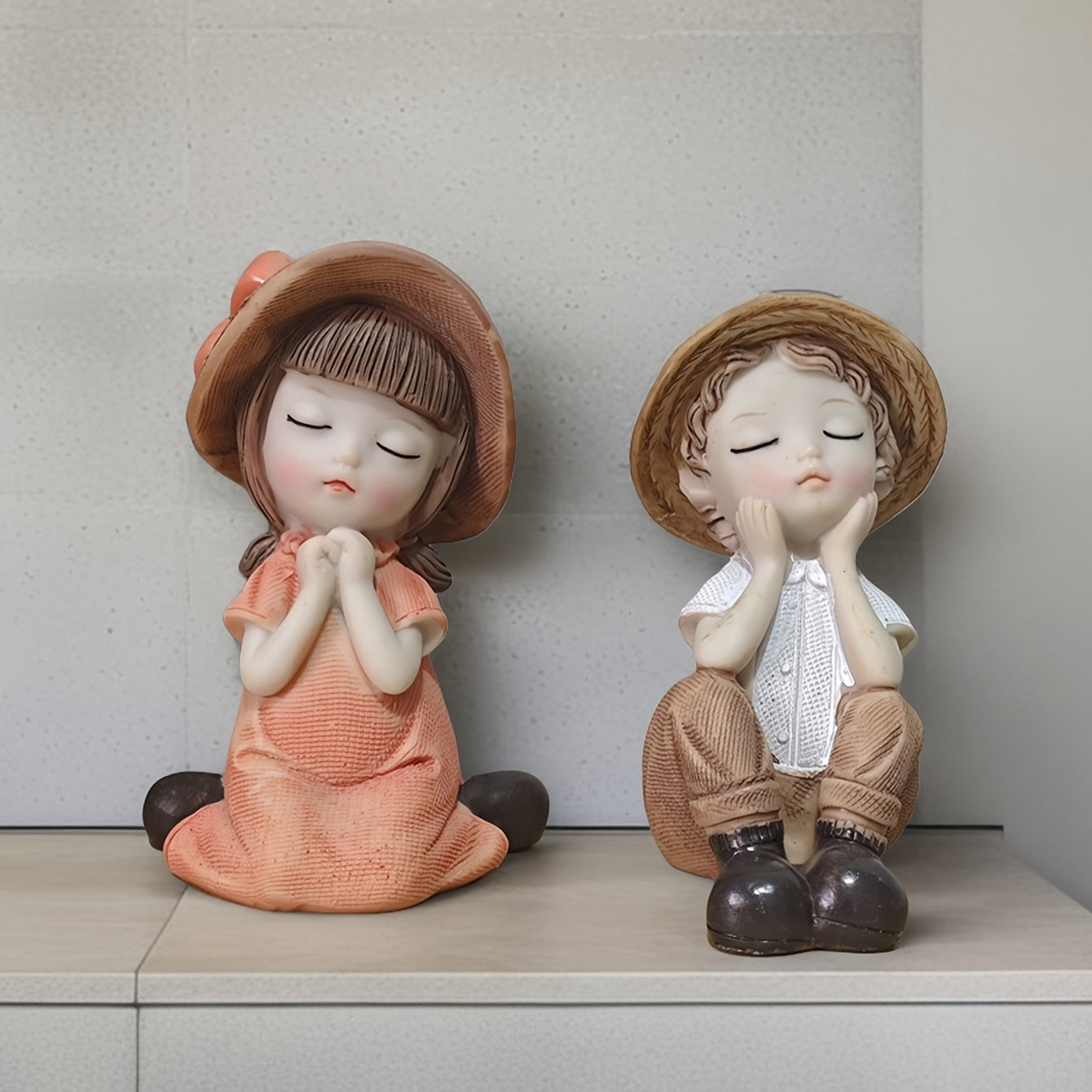 A Set of Two Adorable Mini Decorations Featuring a Boy And a Girl, Including Statues And Doll Sets Made from Resin