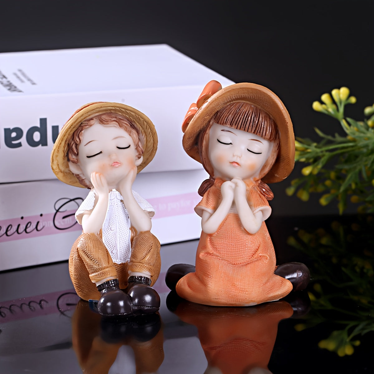 A Set of Two Adorable Mini Decorations Featuring a Boy And a Girl, Including Statues And Doll Sets Made from Resin